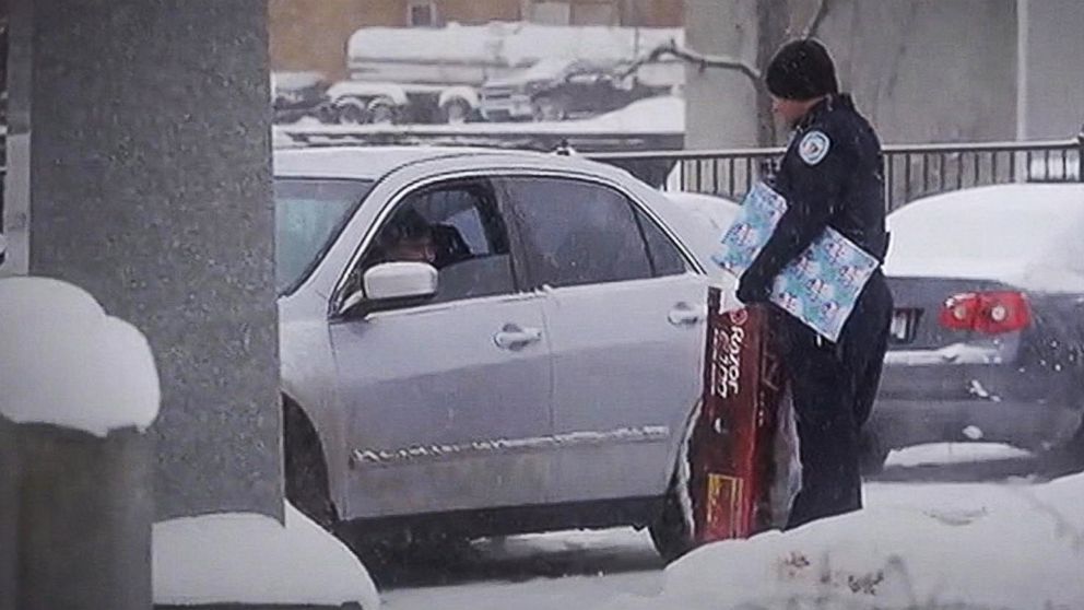 PHOTO: Lowell, Michigan police officers surprise drivers with presents during traffic stops. 