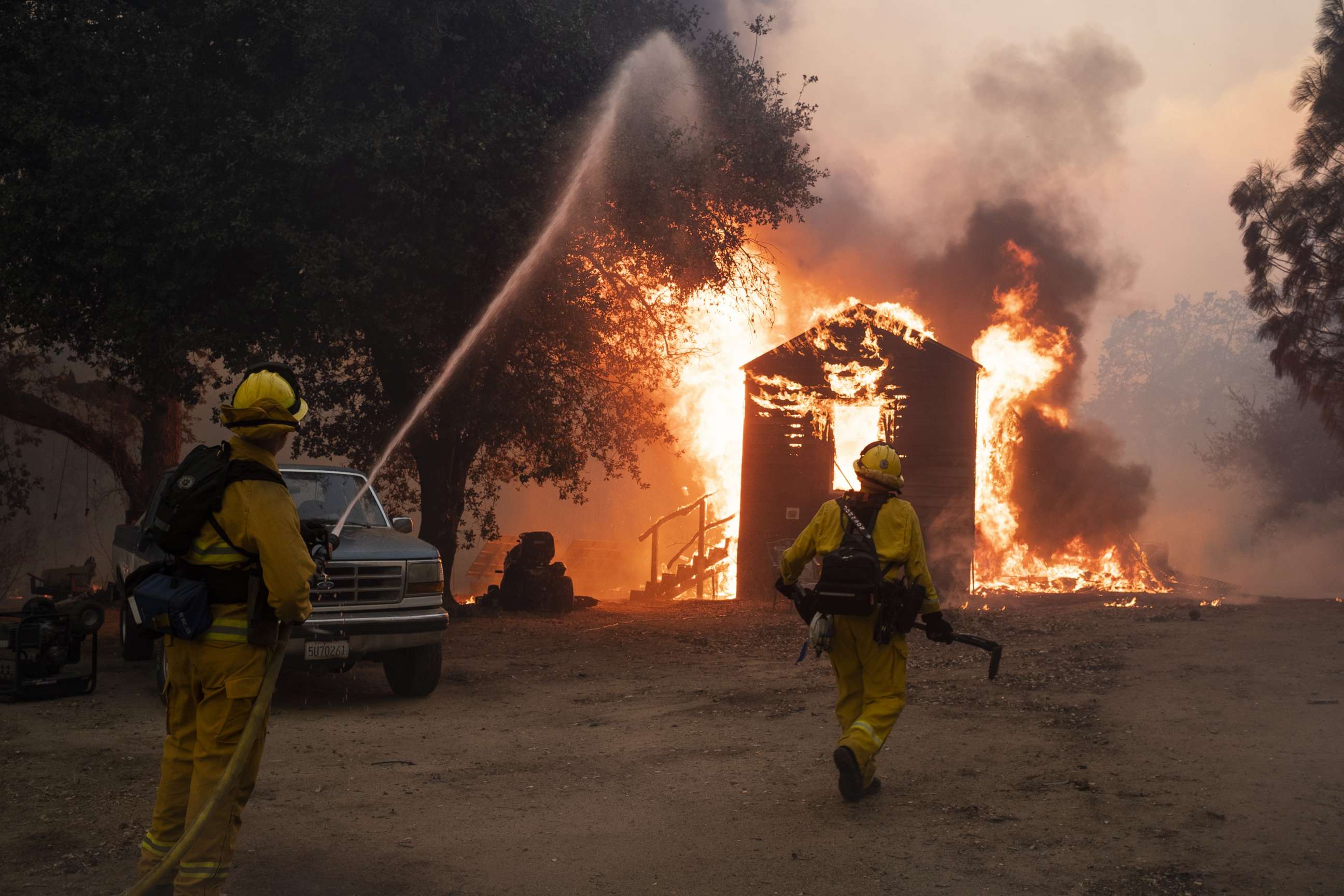 PHOTO: Firefighters work to prevent the fire from spreading during the Zogg fire near the town of Igo in Shasta County, Calif., Sept. 27, 2020.