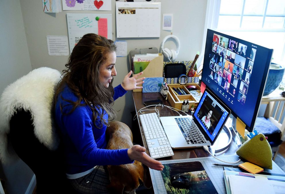 PHOTO: A teacher talks to colleagues from her home using the Zoom digital platform  in Arlington, Va., April 1, 2020.