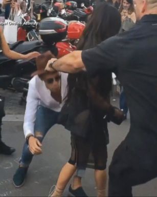 VIDEO: The same man tried to pick up model Gigi Hadid outside of a fashion show in Milan.