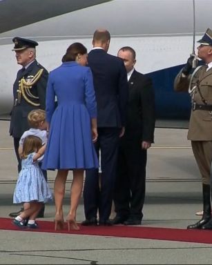 Charlotte, 2, was by the side of her mom, Princess Kate, when she ducked into a curtsy as the royal family departed Poland.