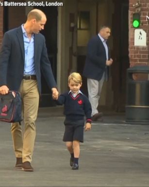 Prince William held 4-year-old son Prince George's hand as he walked him to his very first day of school.