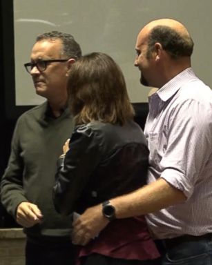 VIDEO: Tom Hanks is taking his reputation for being helpful to a new level, after he assisted a man proposing to his girlfriend.