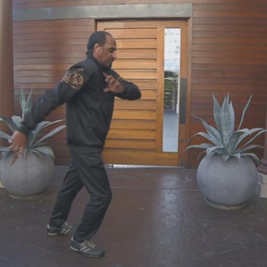 Professional dancer Cooley Jaxson, who danced with Michael Jackson for seven years, shows how he does the "back slide," which the singer later coined the "moonwalk."