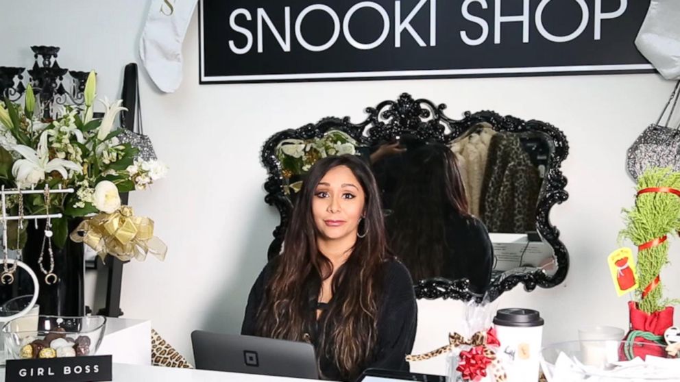 Nicole Snooki Polizzi Jersey Shore cast members shop in the local market  for bags, belts and suitcases! A stall next door started playing loud club  music, which made Snooki start to dance