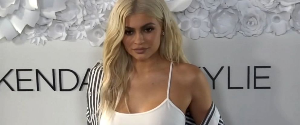 Kylie Jenner Sings 'Rise and Shine' in Python Print, Fluffy Slippers –  Footwear News