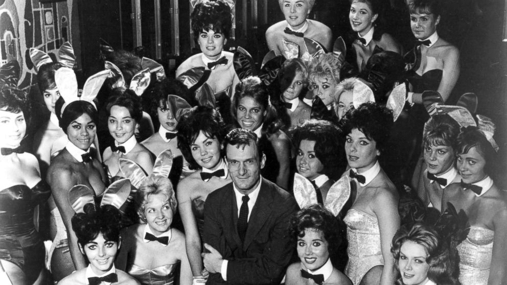 PHOTO: Hugh Hefner poses with Playboy Bunnies at one of the early Playboy Clubs, in 1962.