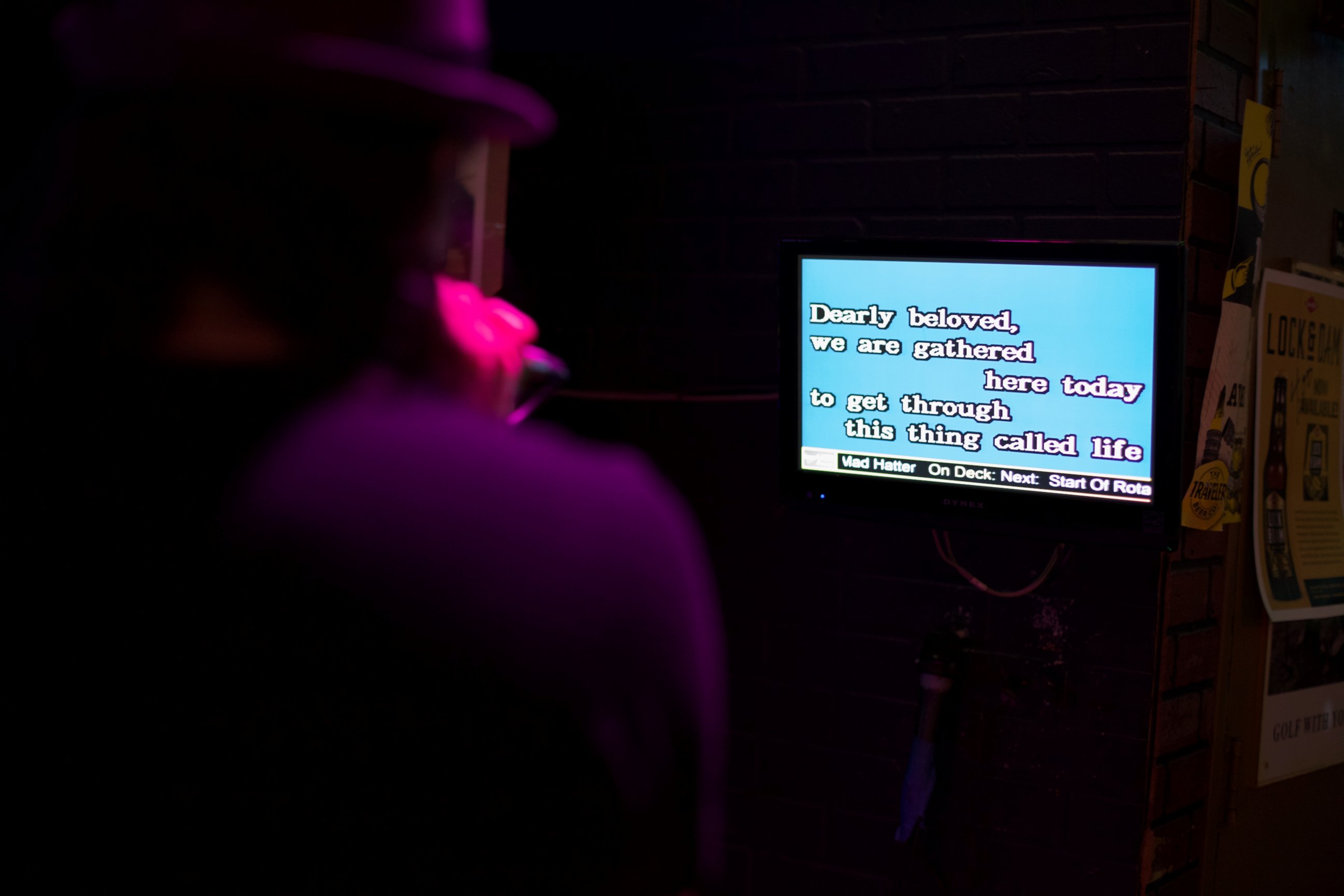 PHOTO:A patron to Otter's Saloon follows the words on the screen as he sings one of Prince's songs during a night of karaoke dedicated to Prince's memory. 