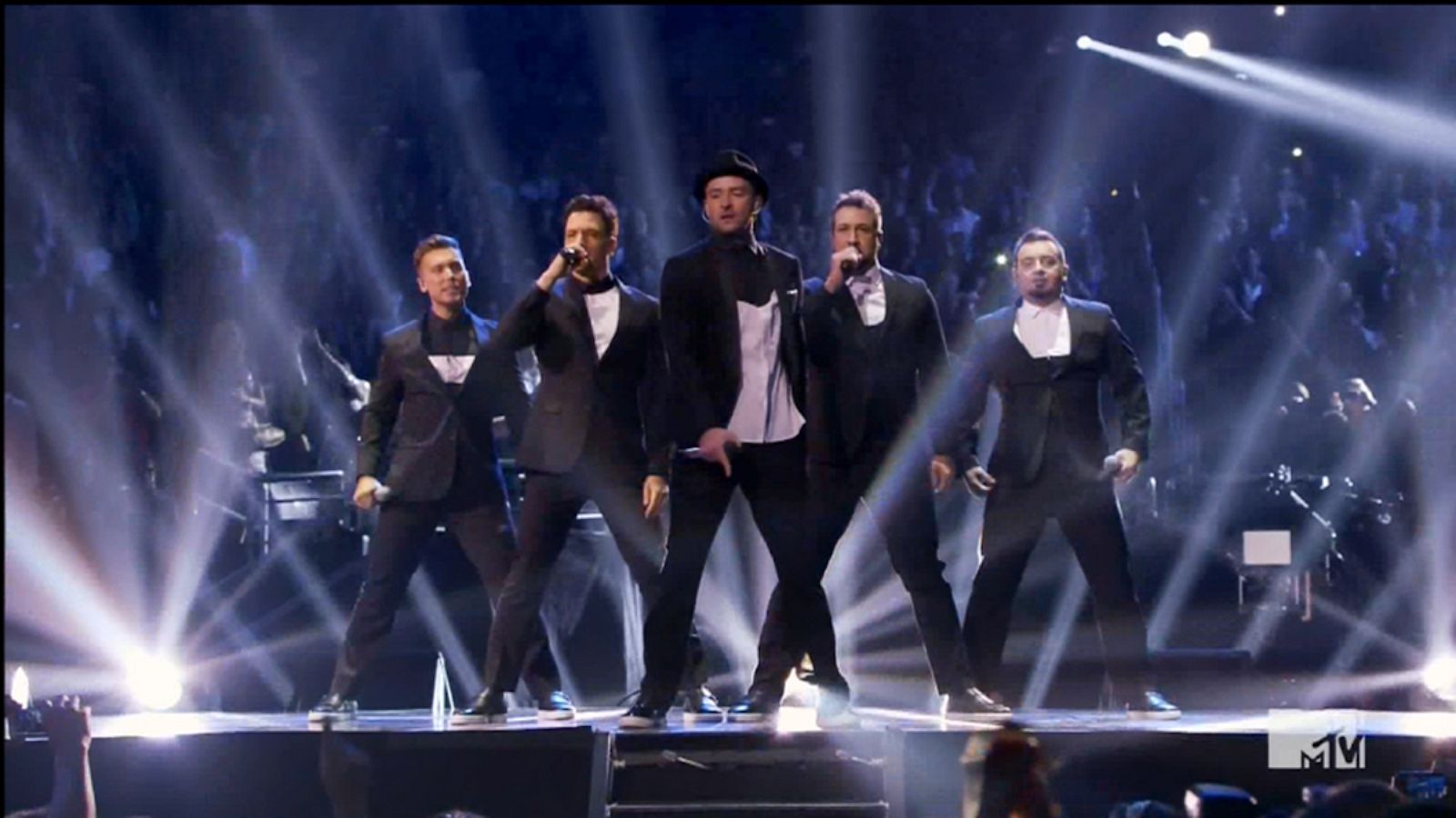 Justin Timberlake waves to the 80,000 faces on stage at the