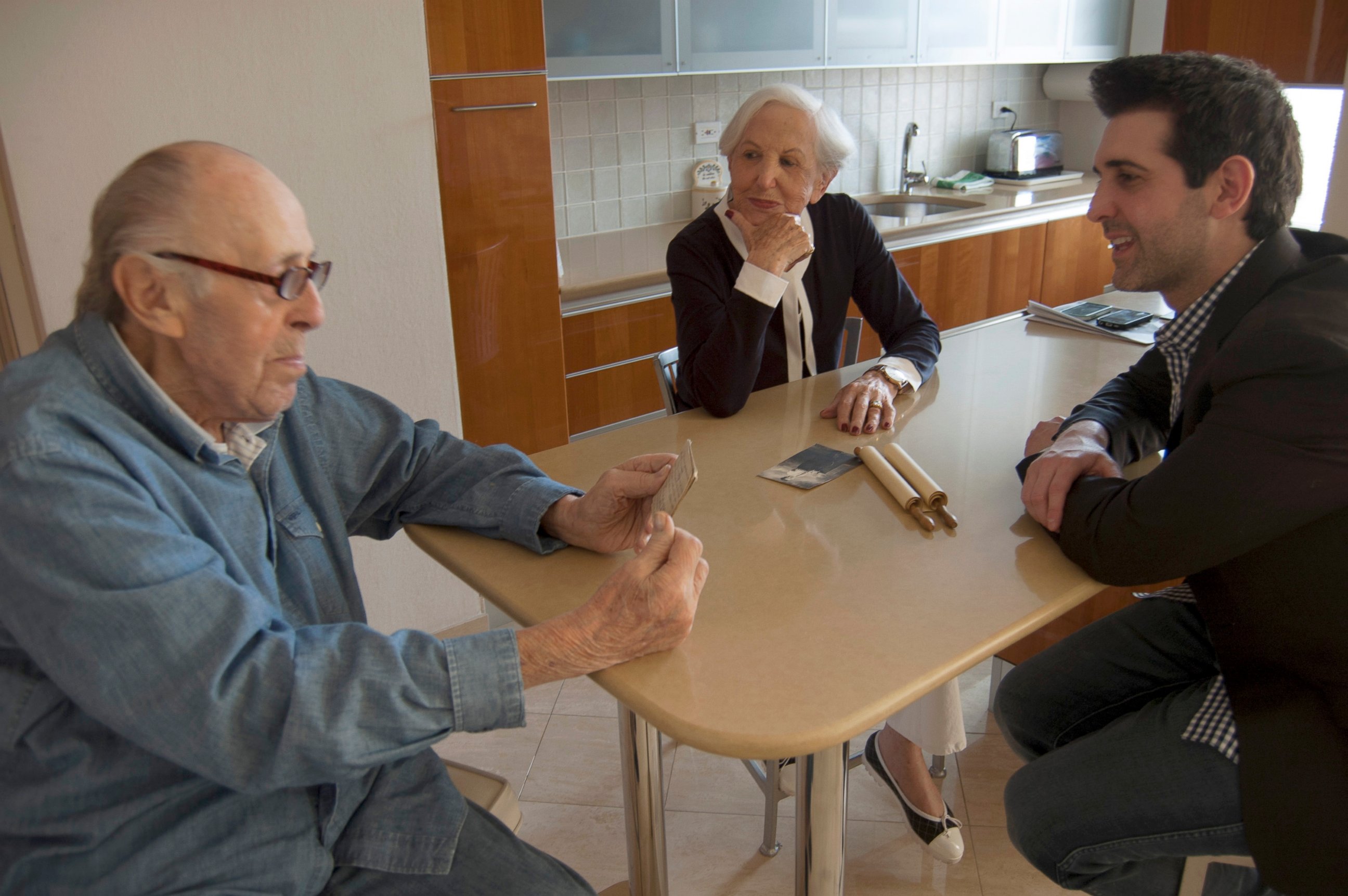 PHOTO: Michael Rothman sits down with grandfather Paul Rothman, left, for a discussion on heritage.