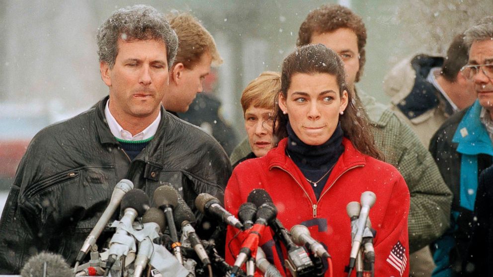 PHOTO: Olympic figure skater Nancy Kerrigan stands at a news conference in Boston, Jan. 14, 1994, as her agent Jerry Solomon, left, looks on. 