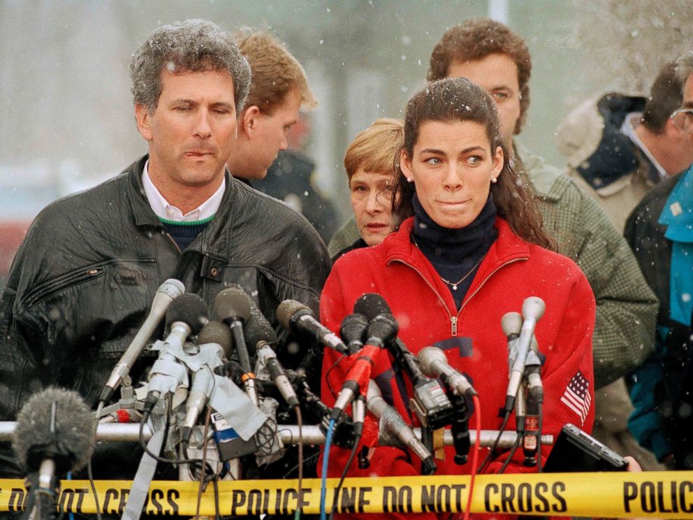 PHOTO: Olympic figure skater Nancy Kerrigan stands at a news conference in Boston, Jan. 14, 1994, as her agent Jerry Solomon, left, looks on.