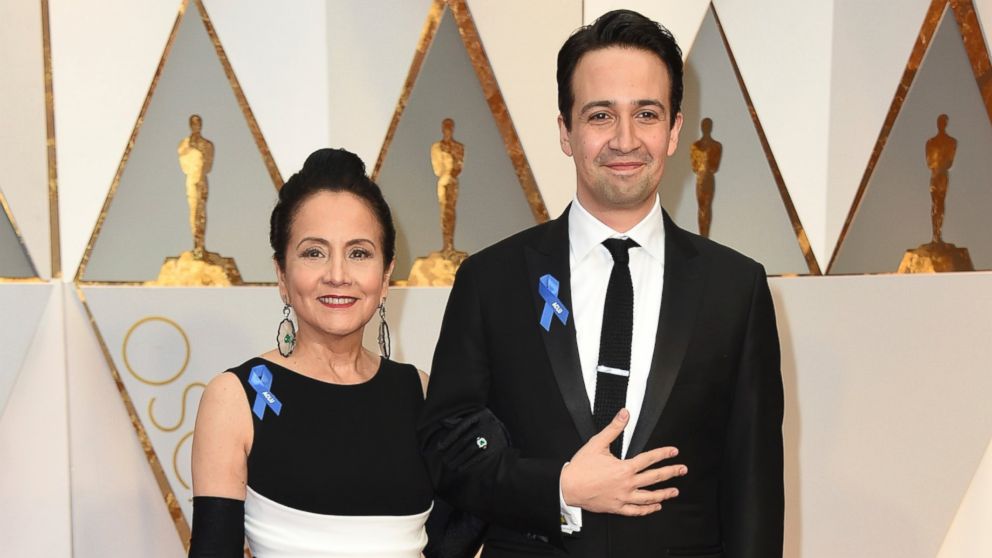Luz Towns-Miranda, left, and Lin-Manuel Miranda arrive at the Oscars on Feb. 26, 2017, at the Dolby Theatre in Los Angeles. 