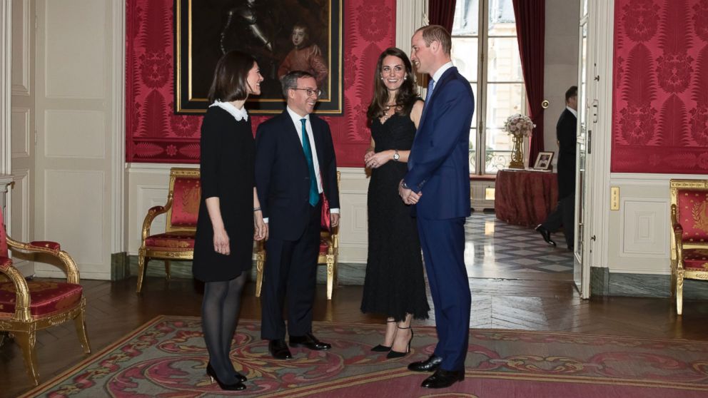 PHOTO: Britain's ambassador to France, Lord Ed Llewellyn, second left, and his wife Anne, greet Prince William and Kate, Duchess of Cambridge as they arrive for a reception at the British embassy in Paris, March 17, 2017.