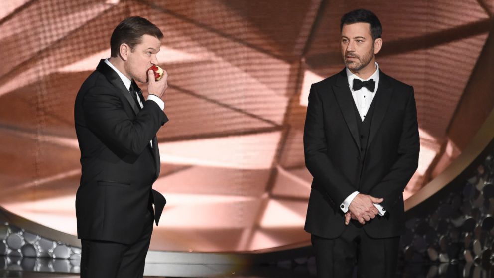 Matt Damon, left, and host Jimmy Kimmel appear on stage at the 68th Primetime Emmy Awards, Sept. 18, 2016, at the Microsoft Theater in Los Angeles. 