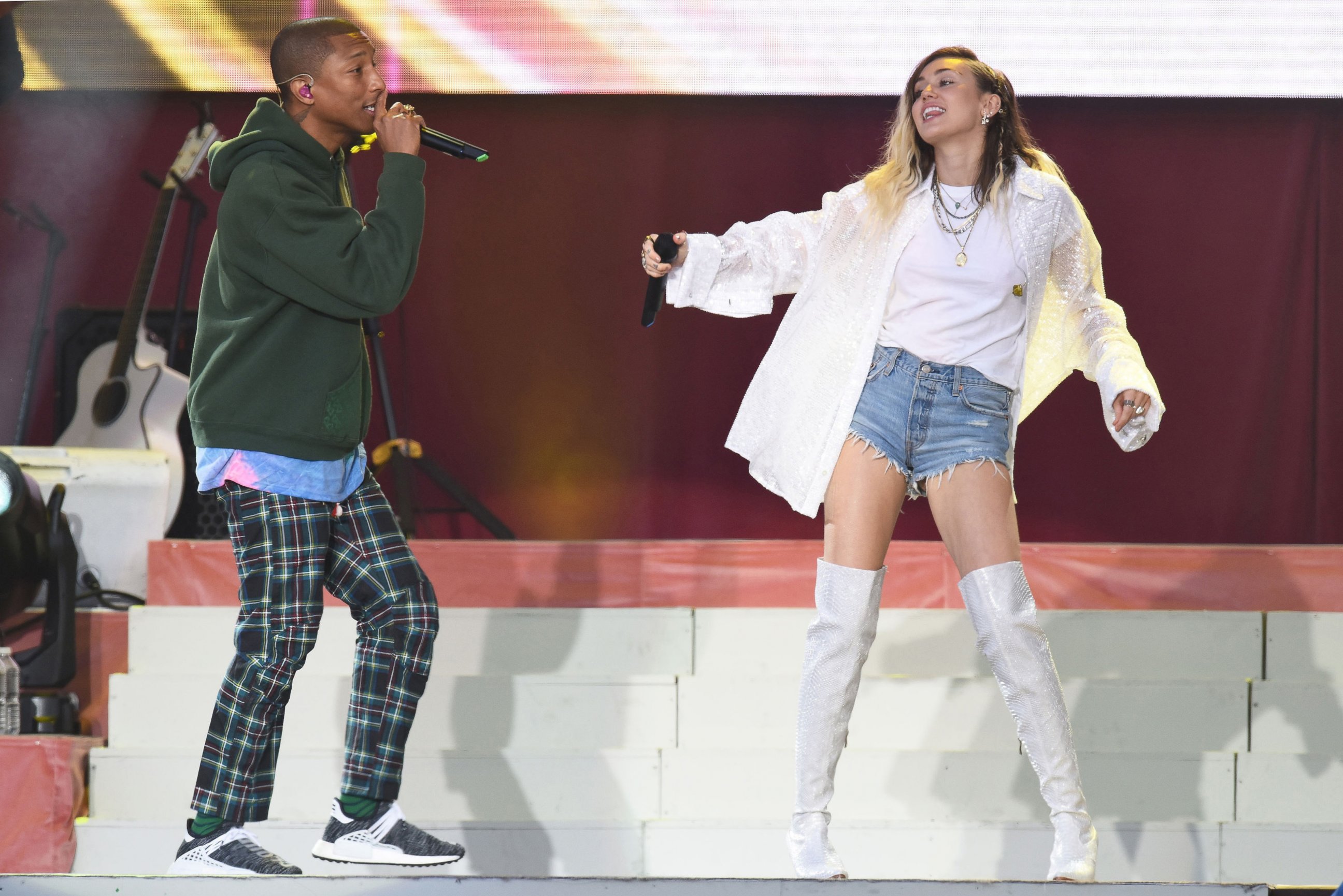 PHOTO: Singers Pharrell Williams, left, and Miley Cyrus perform at the One Love Manchester tribute concert in Manchester, north western England, June 4, 2017.