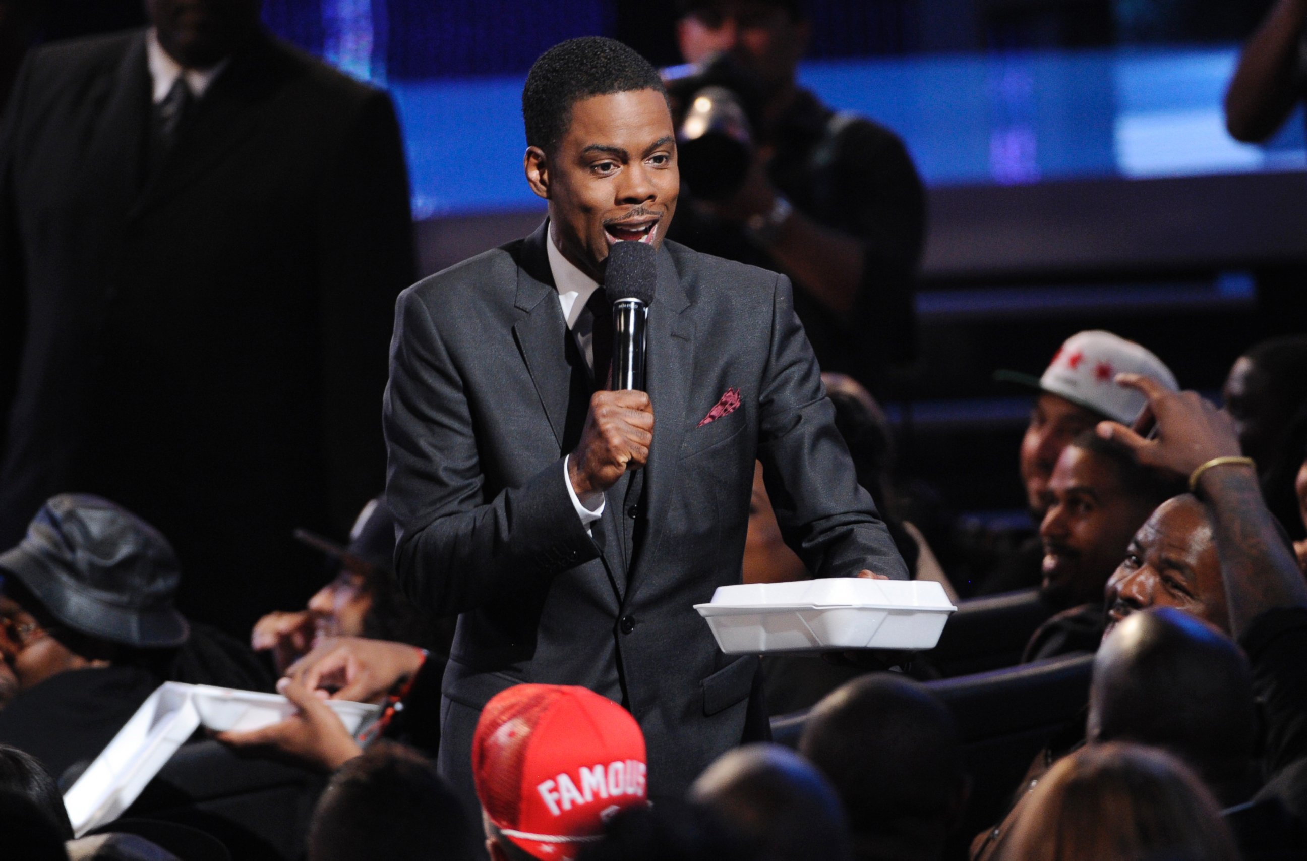 PHOTO: Host Chris Rock hands out fried chicken and waffles at the BET Awards at the Nokia Theatre, June 29, 2014, in Los Angeles.