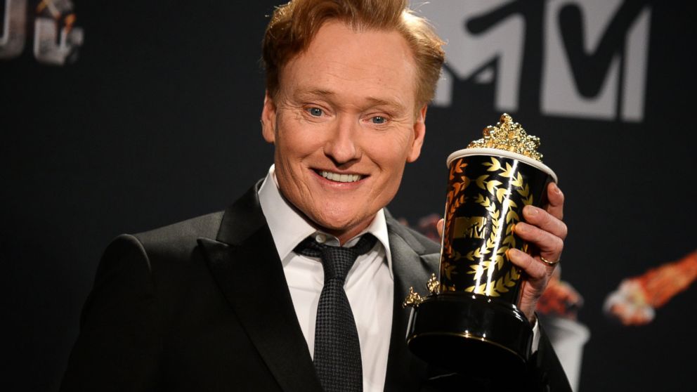 Conan O'Brien poses in the press room at the MTV Movie Awards, April 13, 2014, at Nokia Theatre in Los Angeles.