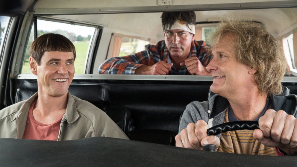 Jim Carrey, left, Jeff Daniels, right, and Rob Riggle in a scene from "Dumb and Dumber To." 