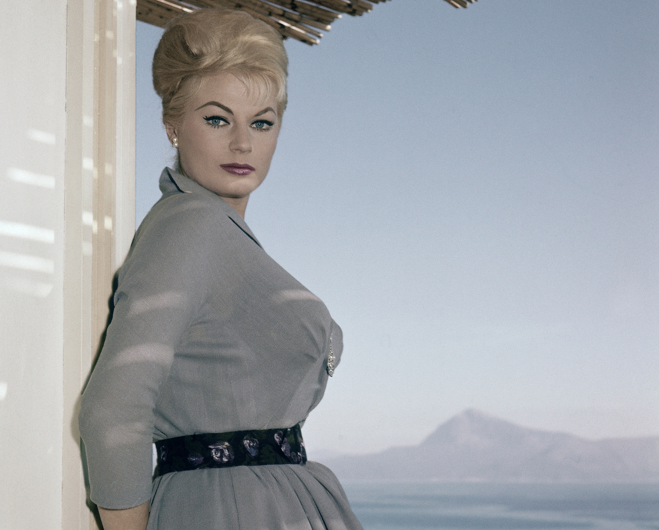 In this Nov. 29, 1960 photo, Swedish actress Anita Ekberg poses on the terrace of her hotel in Maratea, southern Italy.