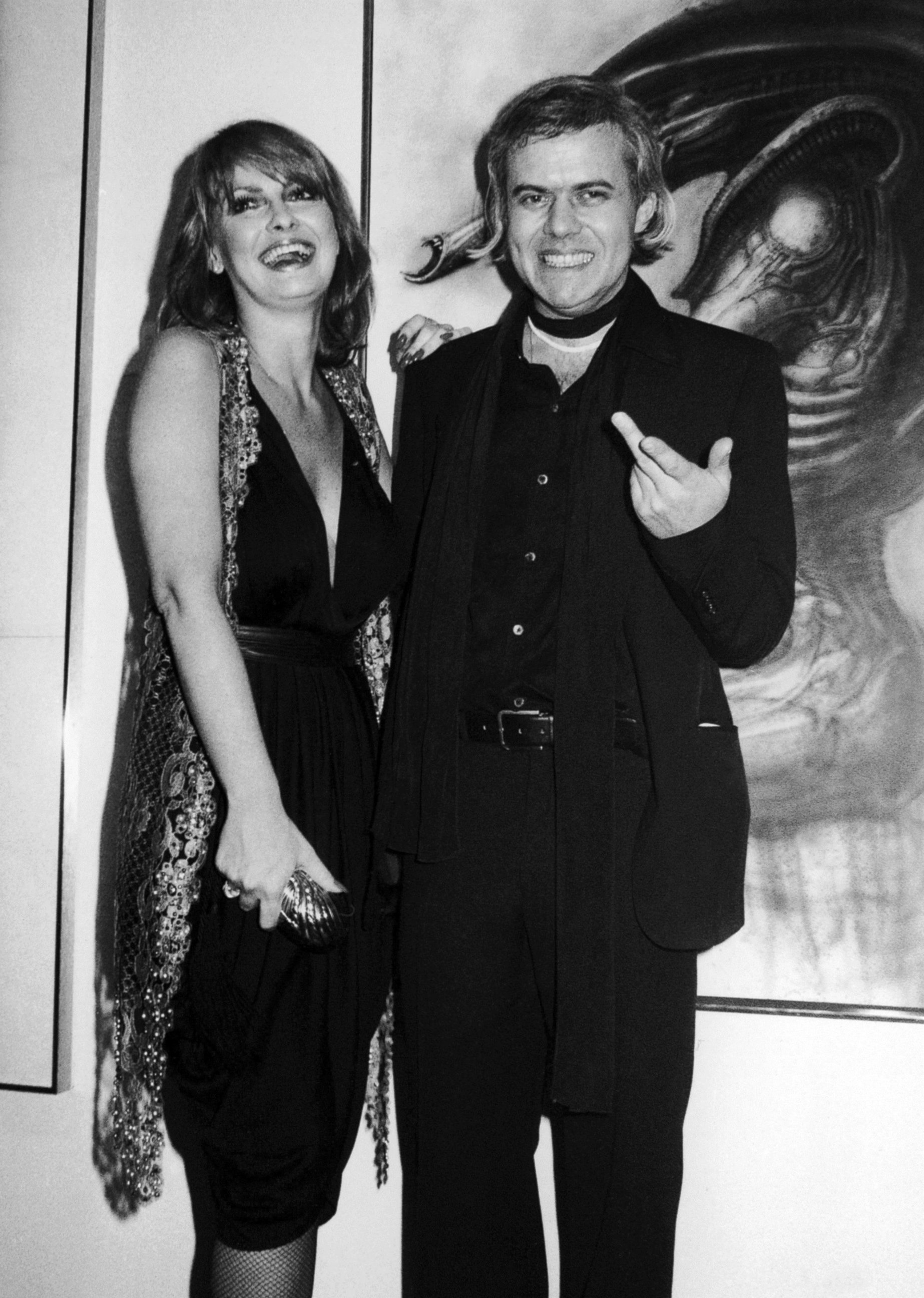 PHOTO: In this April 1980 file photo, Swiss artist H.R. Giger, right, poses with model Anneka Vasta at the opening of an exhibition in New York. 