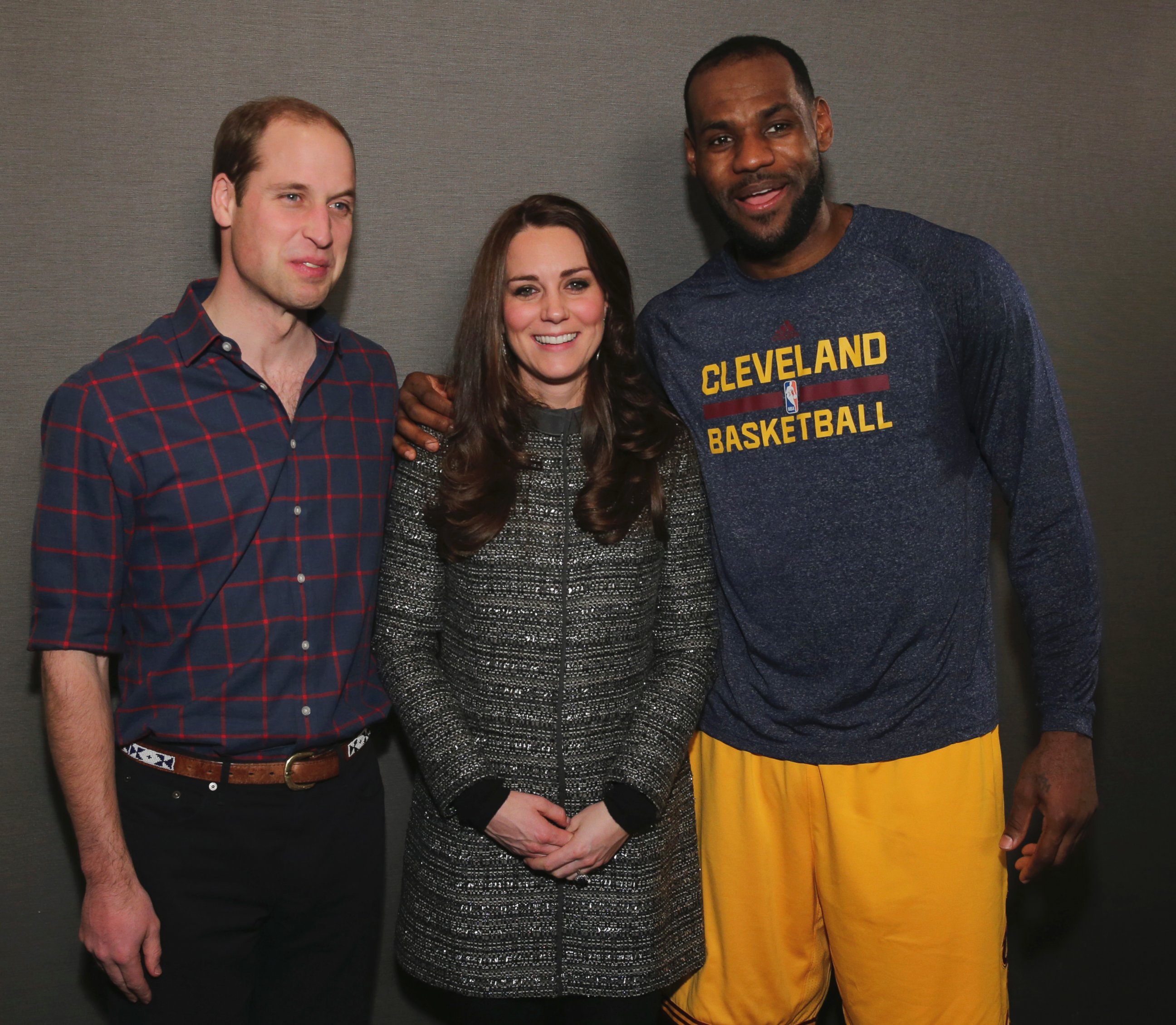 Britain's Prince William, left, and Kate, Duchess of Cambridge pose with Cleveland Cavaliers' LeBron James, right, backstage of an NBA basketball game between the Cavaliers and the Brooklyn Nets on Monday, Dec. 8, 2014, in New York.