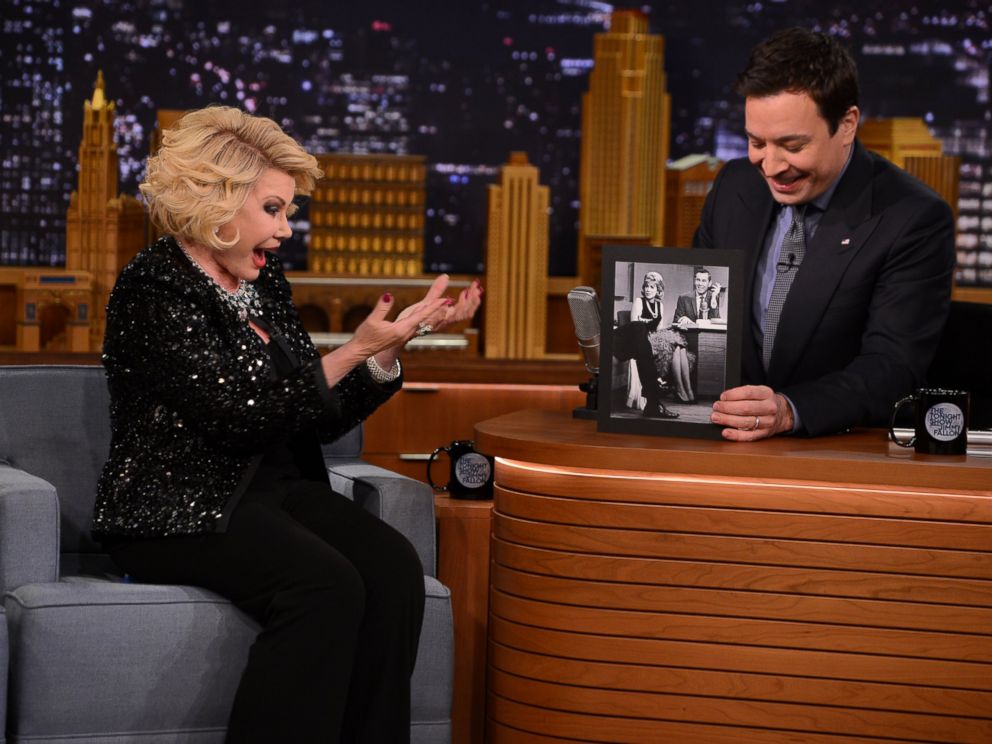 PHOTO: This March 27, 2014 photo released by NBC shows comedian Joan Rivers, left, with host Jimmy Fallon, during an appearance on The Tonight Show Starring Jimmy Fallon, in New York.