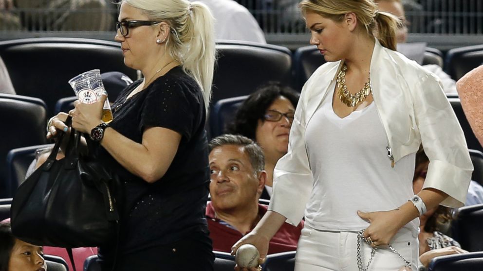 PHOTO: Supermodel Kate Upton, right, carries her baseball as she leaves a game between the Detroit Tigers and the New York Yankees at Yankee Stadium, Aug. 4, 2014.