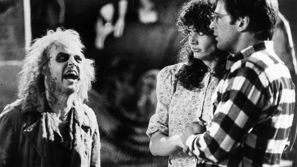Geena Davis and Alec Baldwin, right, react in horror when they first encounter the demonic Betelgeuse (Michael Keaton) in the supernatural comedy "Beetlejuice," 1988.