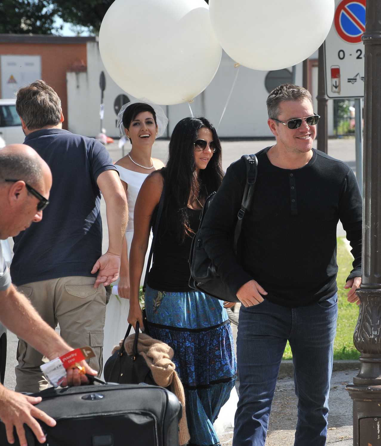 PHOTO: Matt Damon, right, flanked at left by his wife Luciana Barroso, arrive in Venice
