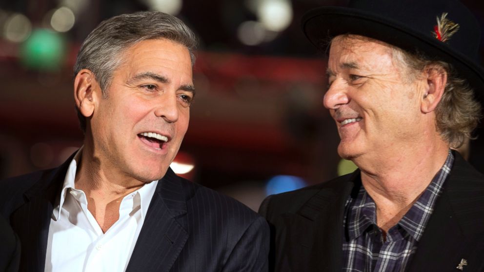 Actors George Clooney and Bill Murray arrive for the screening of the film The Monuments Men during the International Film Festival Berlinale, in Berlin, Feb. 8, 2014.