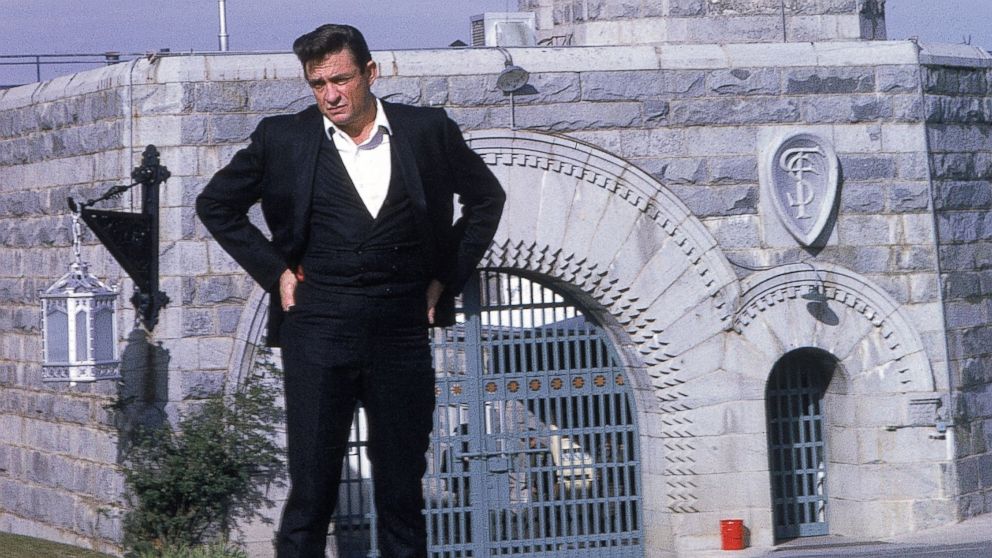In this file photo, Johnny Cash poses outside Folsom Prison the day he recorded his live album "At Folsom Prison" Jan. 13, 1968, in Folsom, Calif.