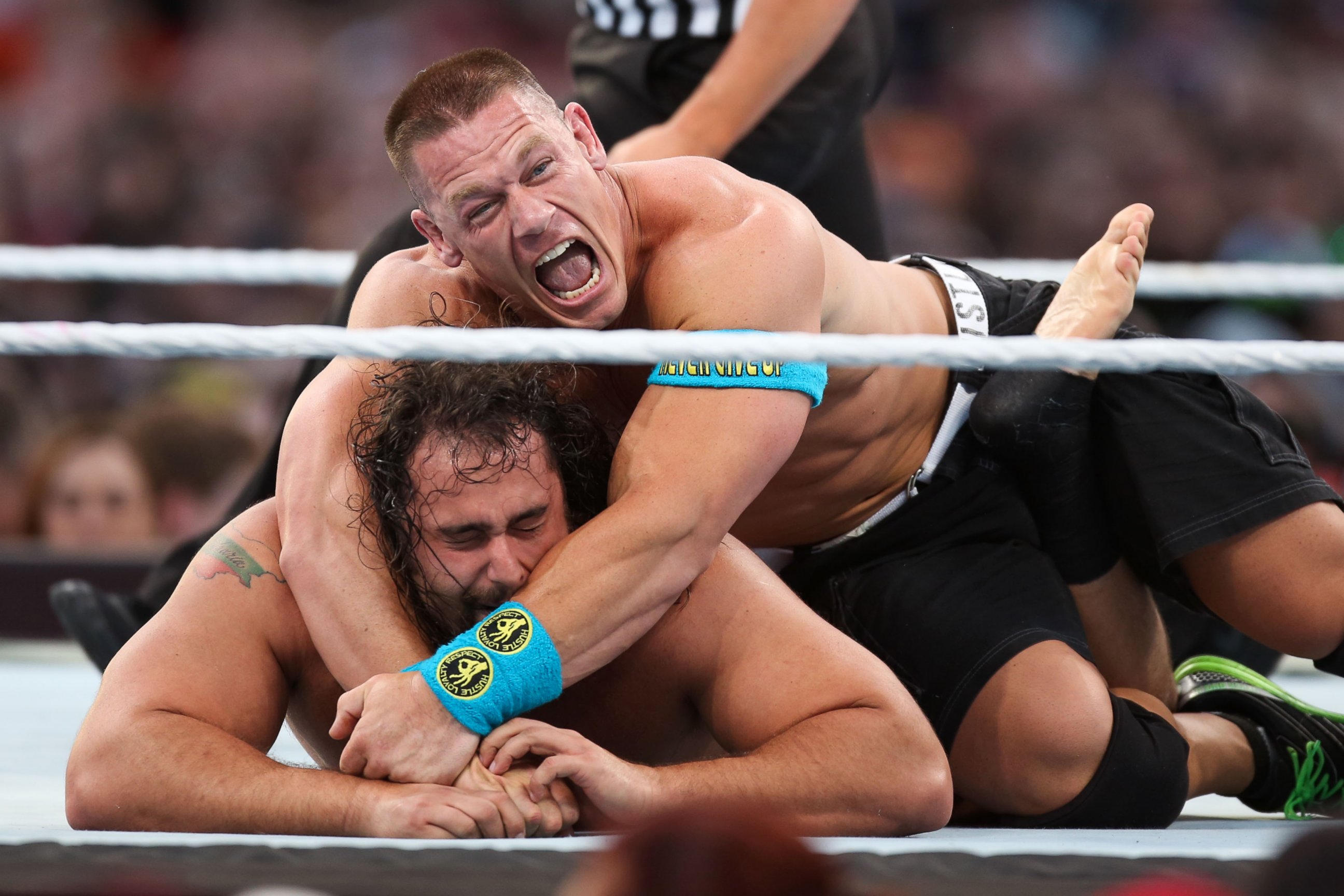 PHOTO:John Cena holds opponent Rusev at Wrestlemania XXXI, March 29, 2015, in Santa Clara, Calif.   