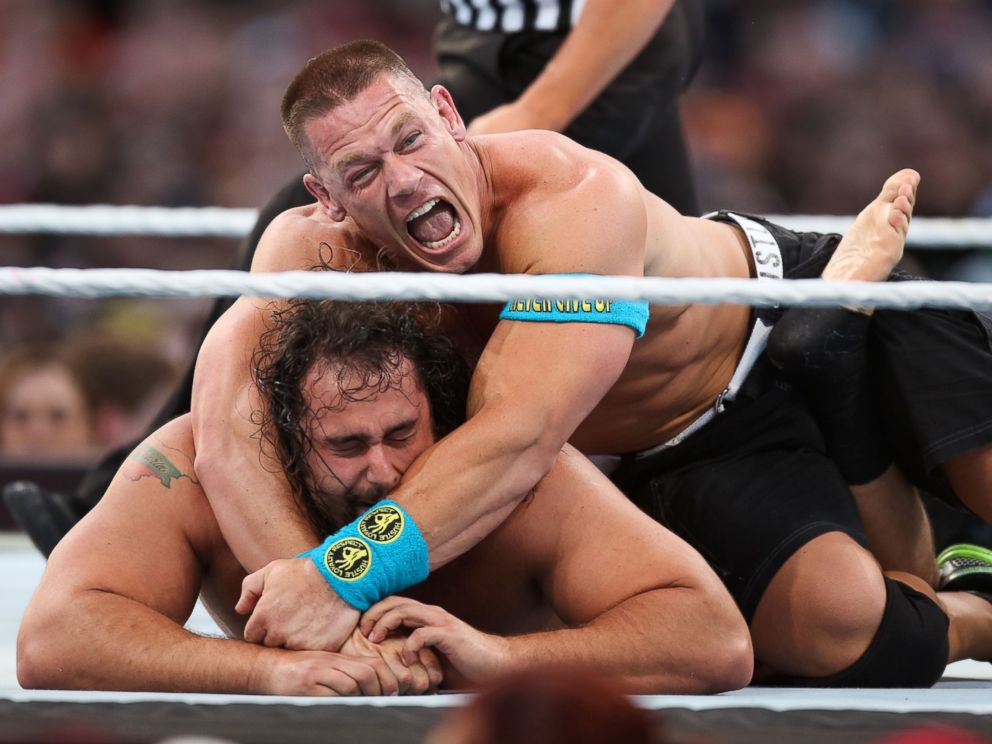PHOTO:John Cena holds opponent Rusev at Wrestlemania XXXI, March 29, 2015, in Santa Clara, Calif.