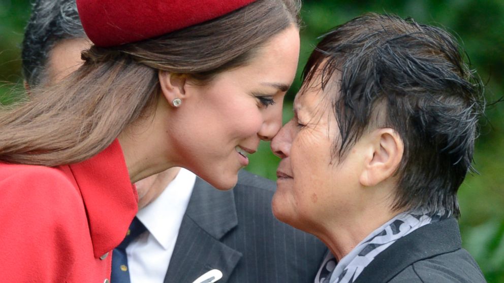 Britain's Duchess of Cambridge Kate, left, receives a hongi, a traditional Maori welcome, from Maori Elder Hiria Hape at their official welcome ceremony, in Wellington, New Zealand, April 7, 2014. 
