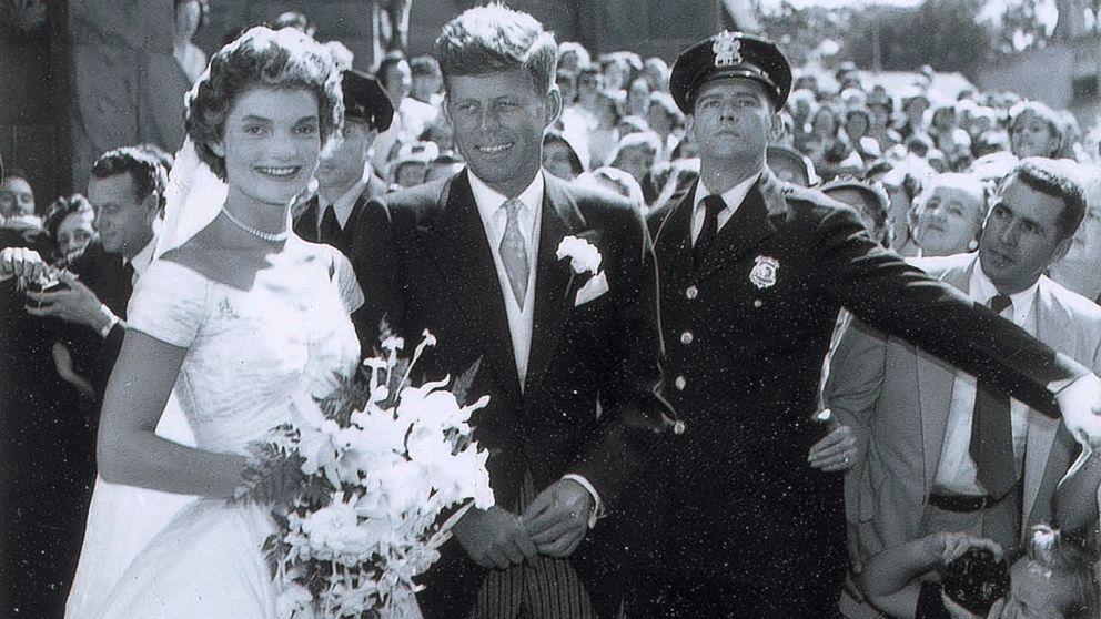 In this Sept. 12, 1953 photo released by RR Auction, John F. Kennedy and his new bride Jacqueline leave St. Mary's Roman Catholic Church after their wedding in Newport, R.I. 