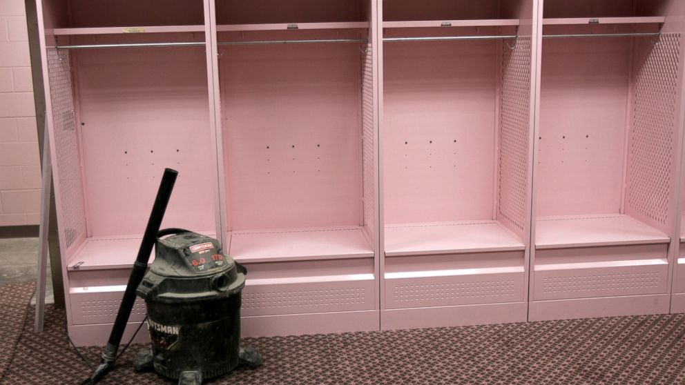 PHOTO: The visiting team field level locker room in Kinnick Stadium at the University of Iowa in Iowa City, Iowa, is seen during a tour, Aug. 20, 2005. The visiting team locker room features pink carpeting, lockers, and bathroom facilities. 