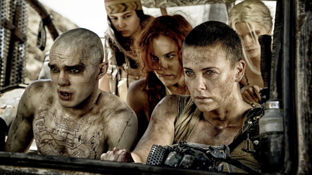 Charlize Theron as Furiosa, right, and Nicholas Hoult as Nux, PHS-4, in a scene from the film, "Mad Max: Fury Road."
