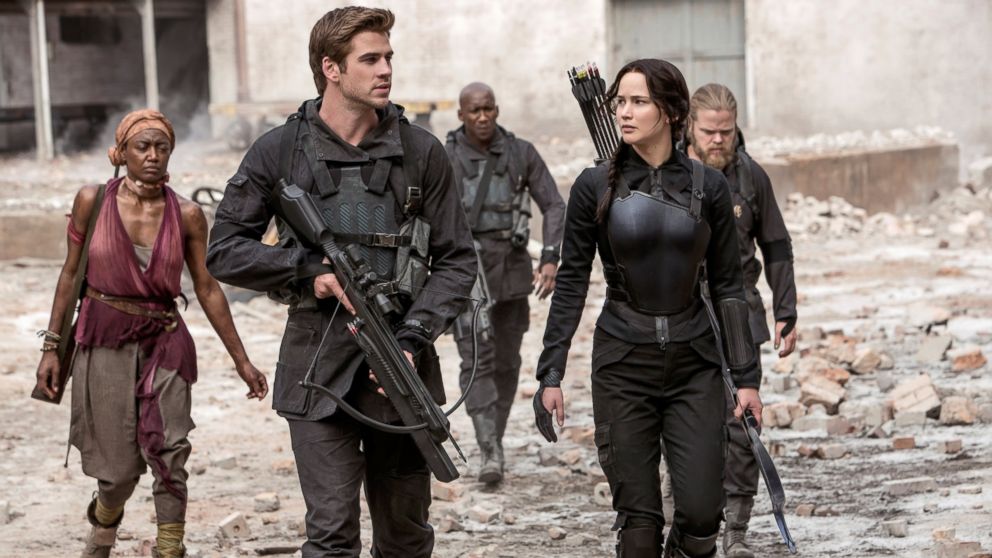 Jennifer Lawrence portrays Katniss Everdeen, right, and Liam Hemsworth portrays Gale Hawthorne in a scene from "The Hunger Games: Mockingjay Part 1."