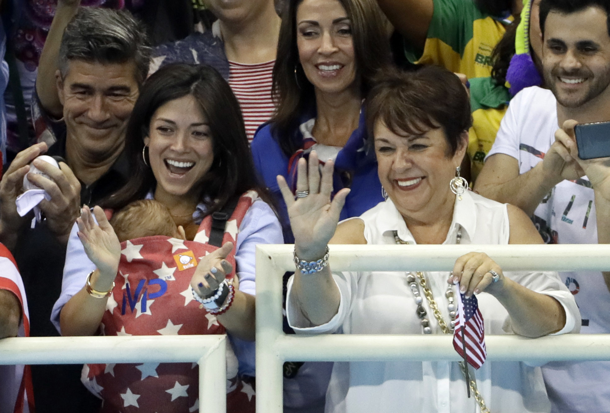 PHOTO: The family of United States' Michael Phelps, mother Debbie, right, and his fiance Nicole Johnson holding their baby Boomer during the swimming competitions at the 2016 Summer Olympics, Aug. 8, 2016, in Rio de Janeiro.