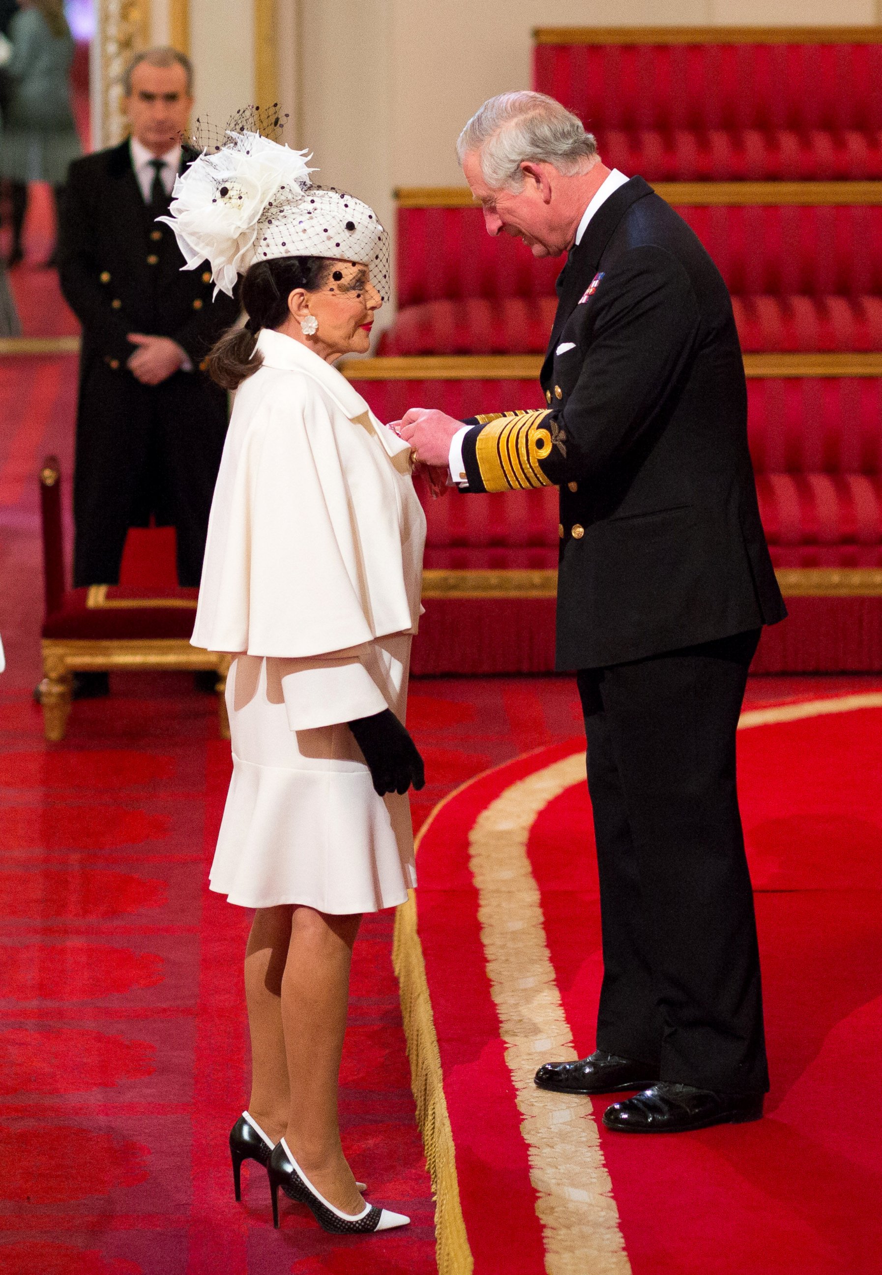 PHOTO: Joan Collins is made a Dame Commander of the British Empire by the Britain's Prince Charles, Prince of Wales, during an Investiture ceremony at Buckingham Palace in London, March 26, 2015.