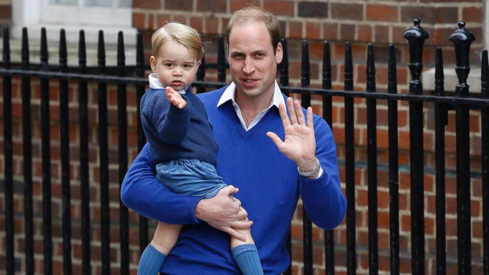 Britain's Prince William and his son Prince George wave as they return to St. Mary's Hospital's exclusive Lindo Wing, London, Saturday, May 2, 2015. William's wife, Kate, the Duchess of Cambridge, gave birth to a baby girl on Saturday morning.