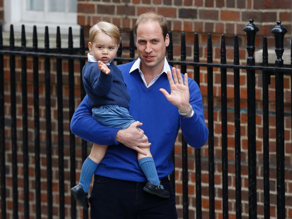 PHOTO: Britains Prince William and his son Prince George wave as they return to St. Marys Hospitals exclusive Lindo Wing, London, Saturday, May 2, 2015.