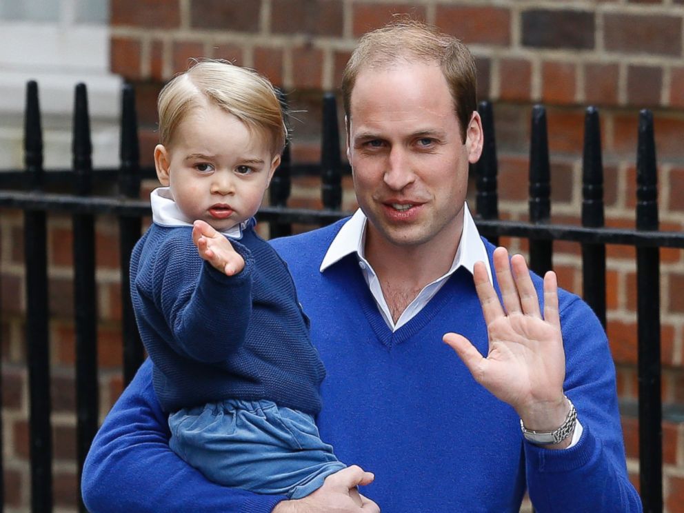 PHOTO: Britain's Prince William and his son Prince George wave as they return to St. Mary's Hospital's exclusive Lindo Wing, London, Saturday, May 2, 2015. 