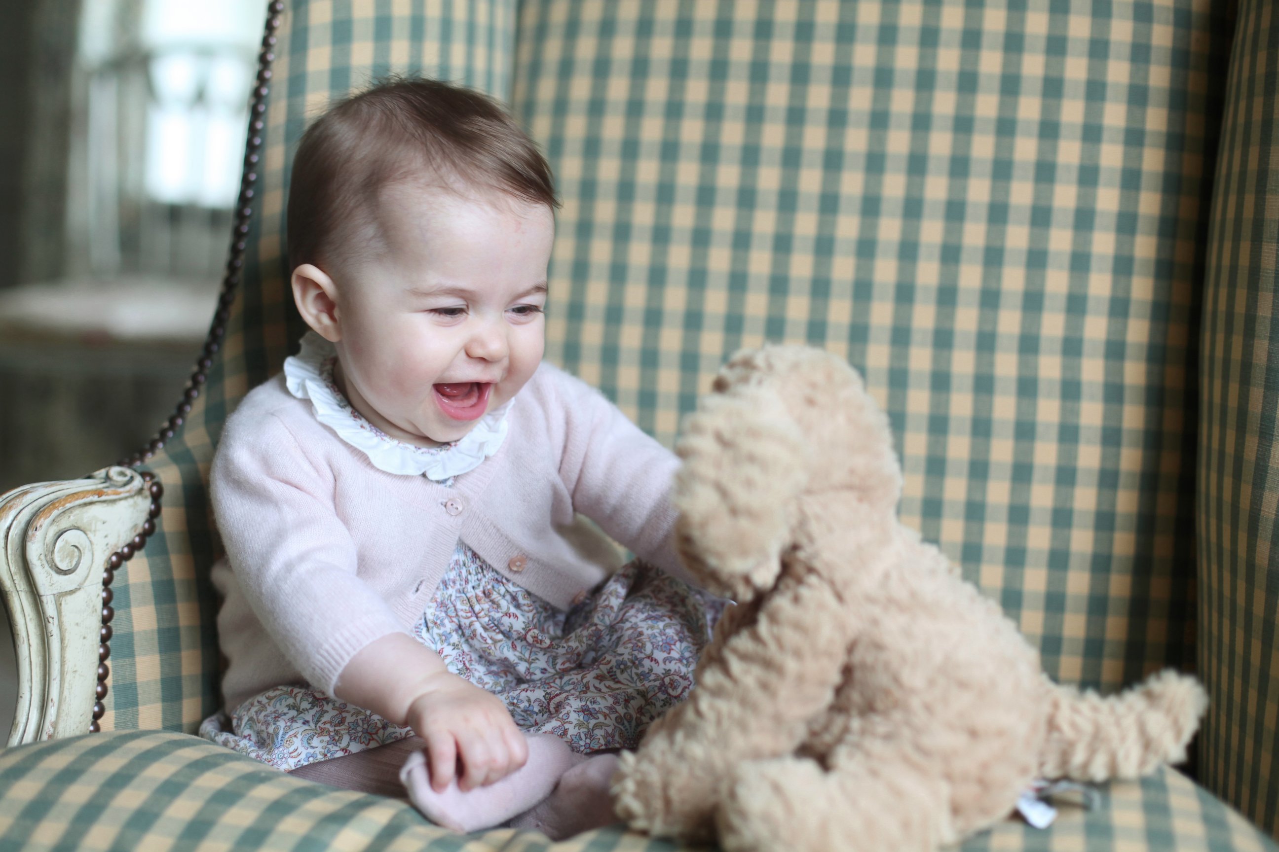 PHOTO: This undated photo released Nov. 29, 2015, by Britain's Duke and Duchess of Cambridge, shows Princess Charlotte with her cuddly toy dog, at Anmer Hall in Sandringham, England.