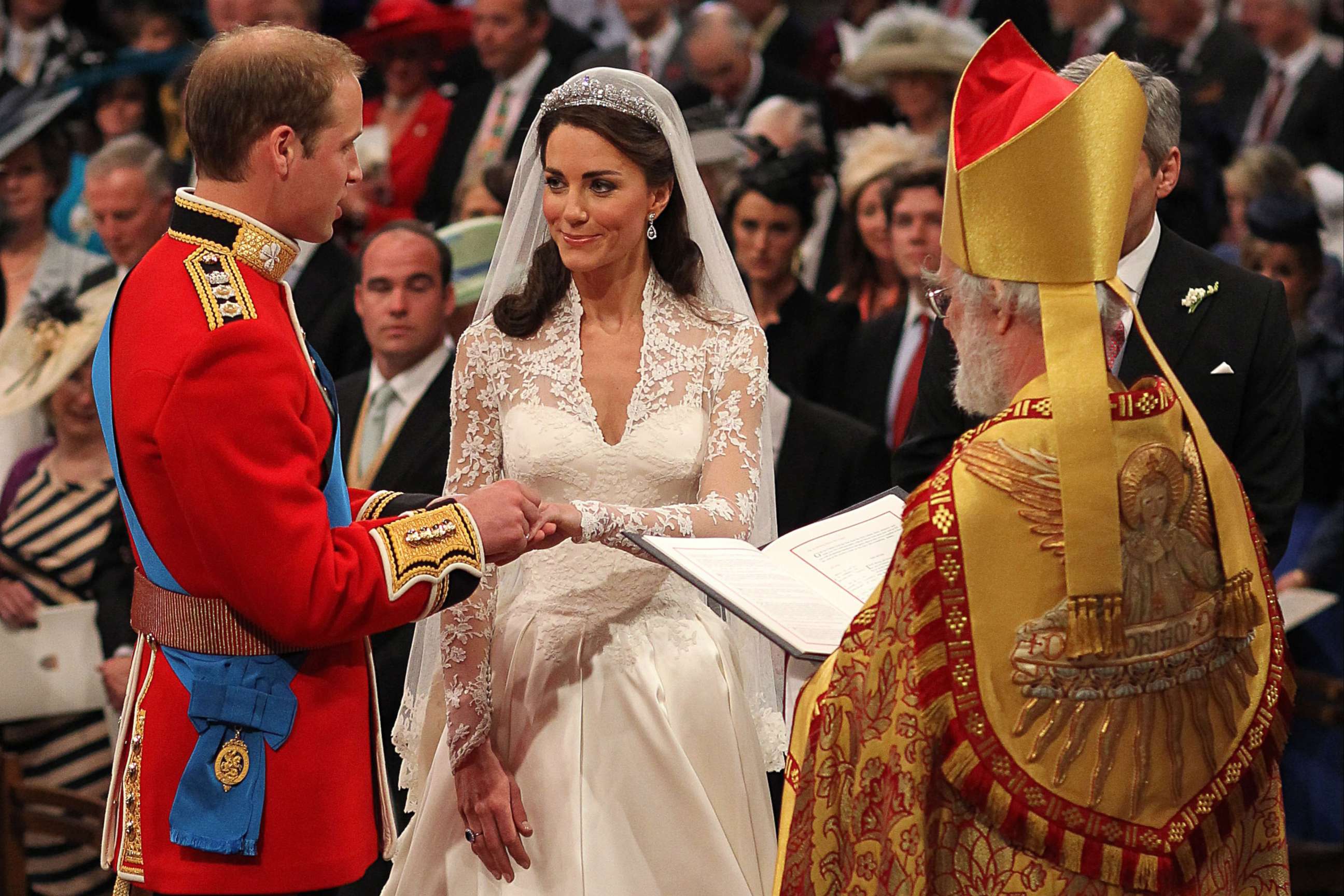 PHOTO: Britain's Prince William and Kate Middleton exchange rings in front of the Archbishop of Canterbury at Westminster Abbey, London, April 29, 2011.