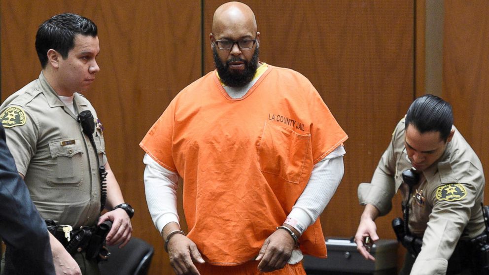 Marion "Suge" Knight, center, arrives in court for a hearing about evidence in his murder case in Los Angeles, March 9, 2015.