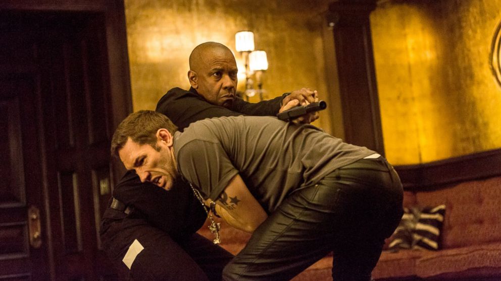 Denzel Washington and Nash Edgerton, foreground, appear in a scene from "The Equalizer."