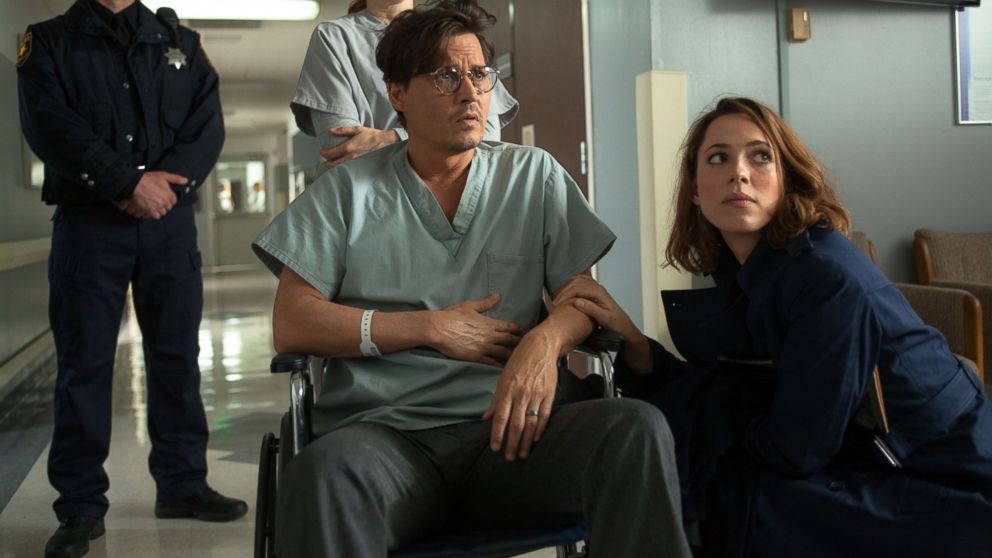PHOTO: Johnny Depp, left, as Will Caster and Rebecca Hall as Evelyn Caster in "Transcendence." 
