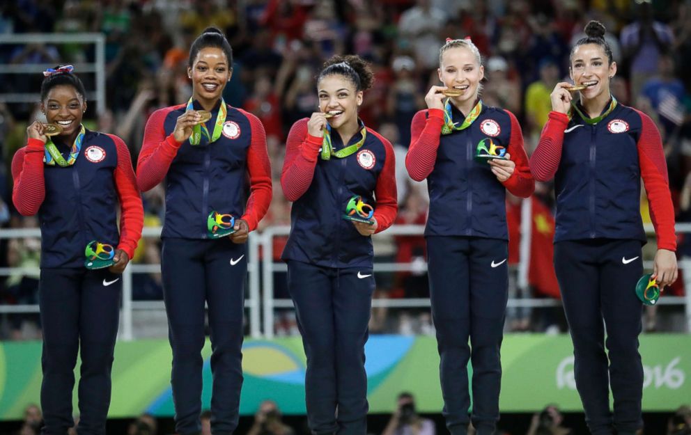 PHOTO: Simone Biles, Gabrielle Douglas, Lauren Hernandez, Madison Kocian and Aly Raisman hold their gold medals during the medal ceremony for the artistic gymnastics women's team at the 2016 Summer Olympics in Rio de Janeiro, Aug. 9, 2016. 